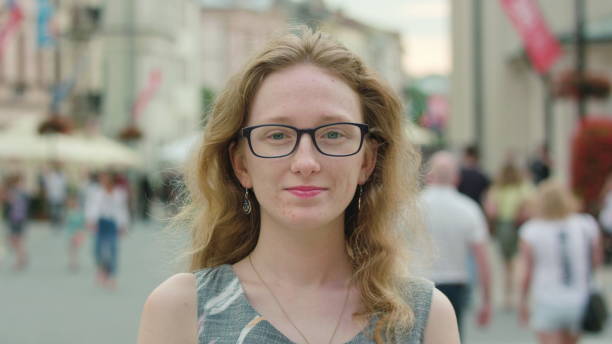 istock A Young Red-Haired Lady Smiling at the Camera 888339332