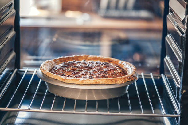 istock Baking Pecan Pie in The Oven for Holidays 888339926