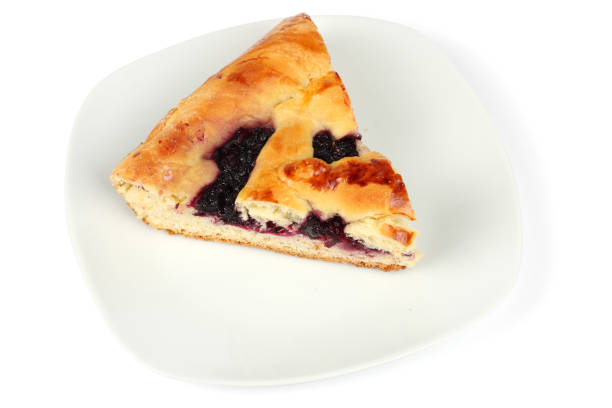 istock cake with blackberry on plate isolated on white background 888340318
