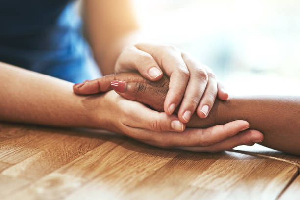 istock You hand is safe with mine 888343170