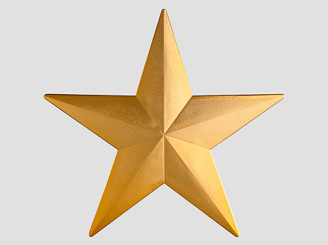 Golden Christmas Star. Top View Close-Up with Text Space.