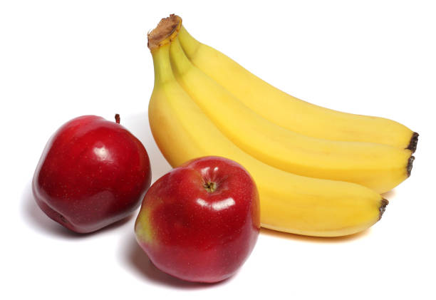 istock banana with red apple isolated on white background 888346828
