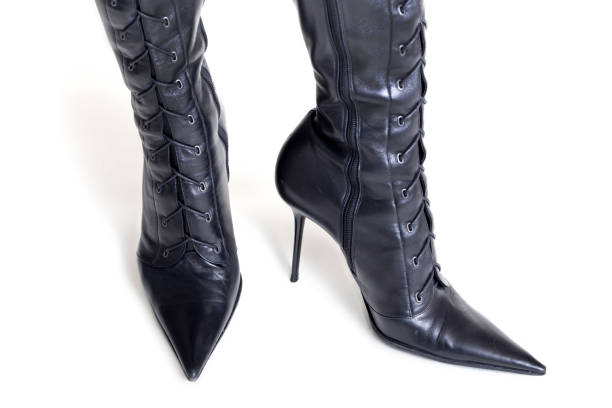 istock Two leather boots with high lacing on white background 888349866
