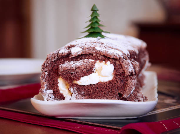 istock A yule, Christmas chocolate log cake with rich dairy cream. 888357878