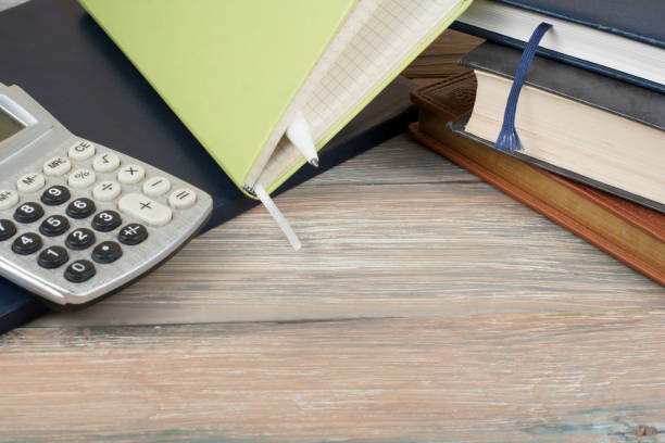 istock Home savings, budget concept. Notepad and calculator on wooden office table. 888358210