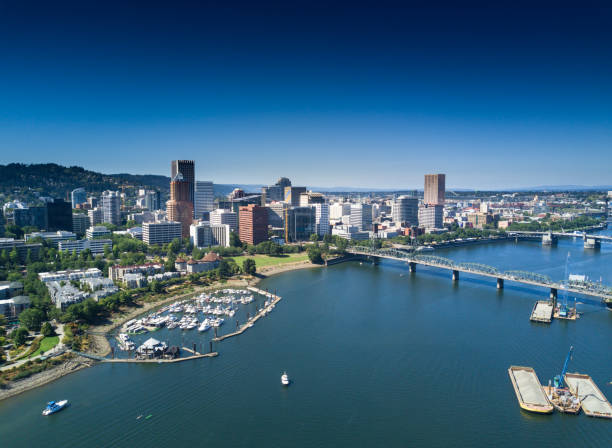Aerial View of Portland Waterfront Drone shot taken from above Portland, looking across the Willamette River towards the downtown skyline. portland oregon photos stock pictures, royalty-free photos & images