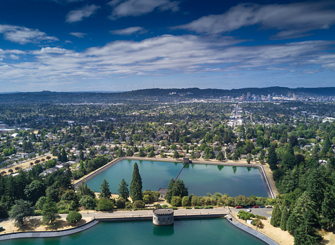 Aerial shot taken from above Washington Park in Portland, Oregon, looking across two reservoirs towards the downtown area.