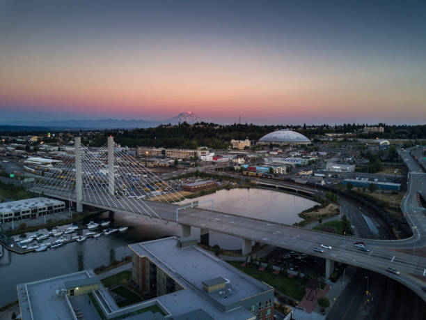 Tacoma at Sunset - Aerial View Aerial shot of downtown Tacoma, including the East 21st Street Bridge, the Tacoma Dome and the Thea Foss Waterway. In the distance, Mt Rainier looms against the colorful sunset. tacoma photos stock pictures, royalty-free photos & images