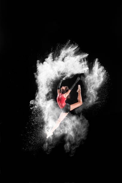 istock Beautiful ballet dancer, dancing with powder on stage 888361626