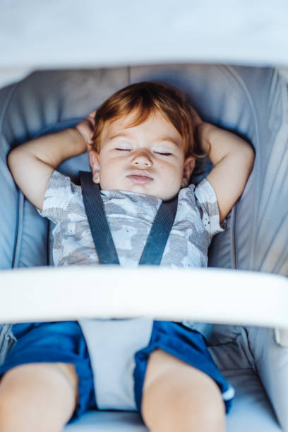 istock Little baby sleeping in a stroller. 888361856