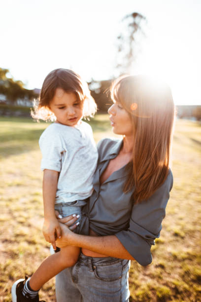 istock mom carrying a little kid 888368806