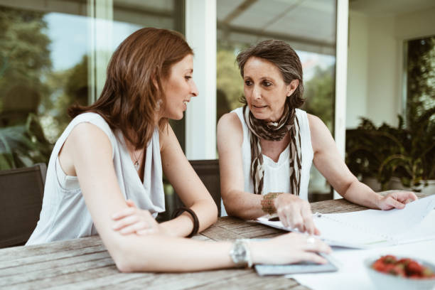 istock mother and daugher talking at home 888370424