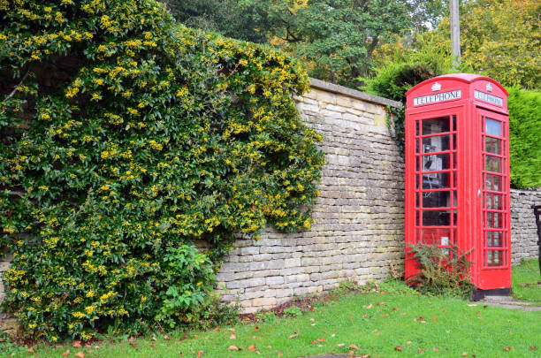 istock Typical English telephone box on an external road 888382020