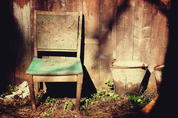 istock Old chair and rusty bucket on a house yard 888398646