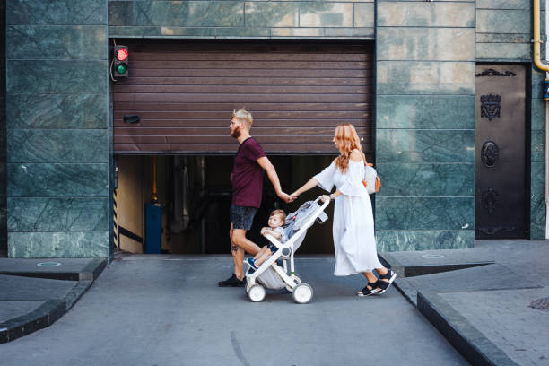 istock man and woman with a stroller 888415856