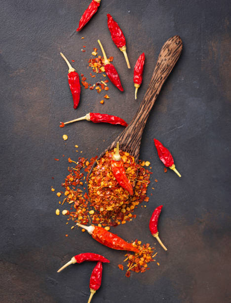 istock Red hot chili peppers on rusty background 888415902