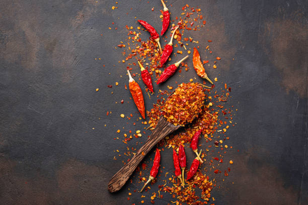istock Red hot chili peppers on rusty background 888418296