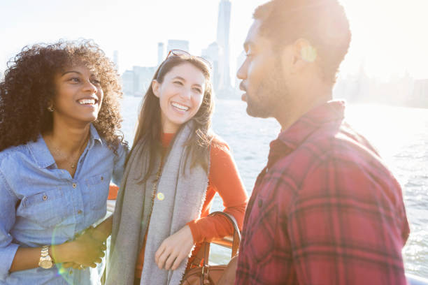 istock Three friends talk on New York City pier 888418772