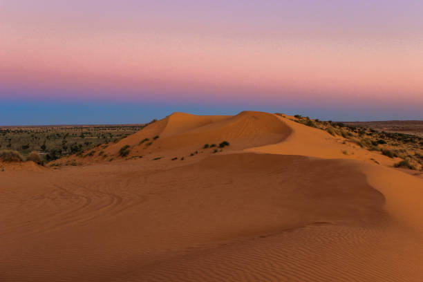 large sand dune in the desert at sunset
