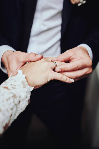 istock Bride and groom with wedding rings 888421910