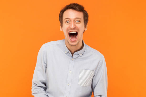 istock Happiness businessman looking at camera and toothy smiling. 888422080