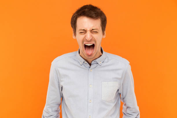 istock Man closed eyes and tongue out 888422118