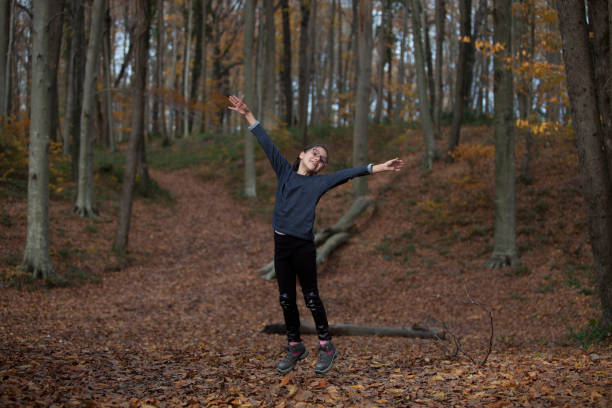 istock happy, jumping girl 888448880