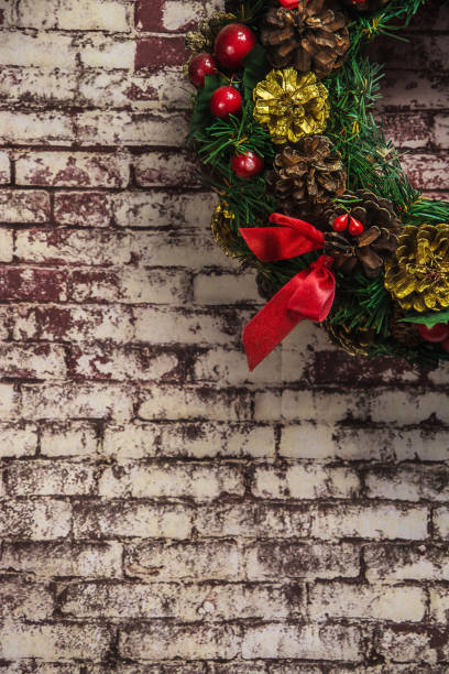 istock christmas wreath on  brick wall background . 888468054