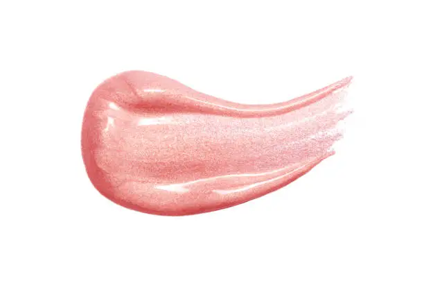 Lip gloss sample isolated on white. Smudged pink lipgloss