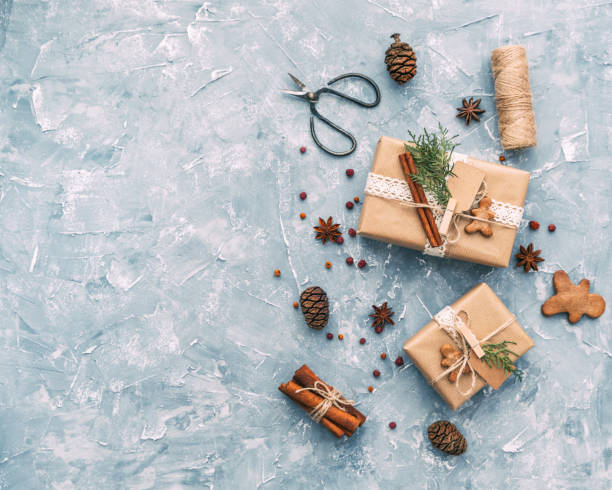 istock Christmas composition with gifts and decoration on blue background. Top view, flat lay, copy space 888487566