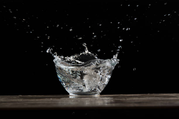 istock bowl of glass with water bursting 888503412