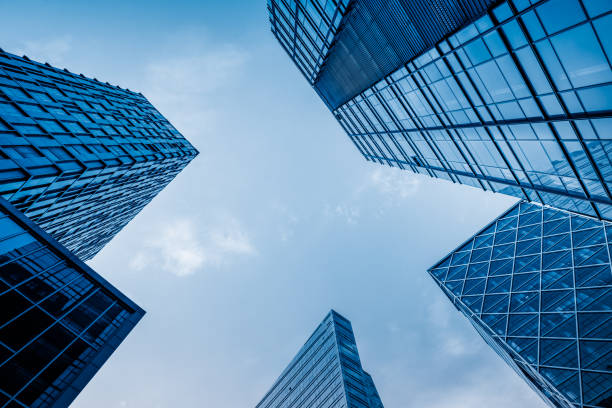 istock High modern skyscrapers over blue sky 888509104