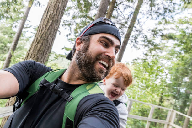 Father Backpacking Hiking with Toddler in Forest