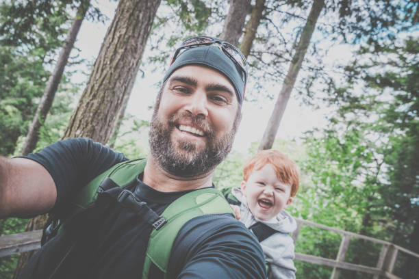 istock Father Backpacking Hiking with Toddler in Forest 888511918