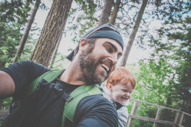 istock Father Backpacking Hiking with Toddler in Forest 888511962