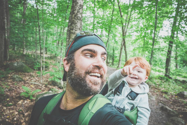 istock Father Backpacking Hiking with Toddler in Forest 888511968
