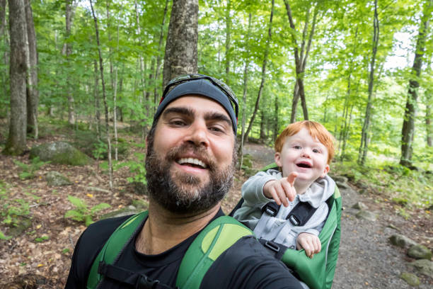 istock Father Backpacking Hiking with Toddler in Forest 888511976