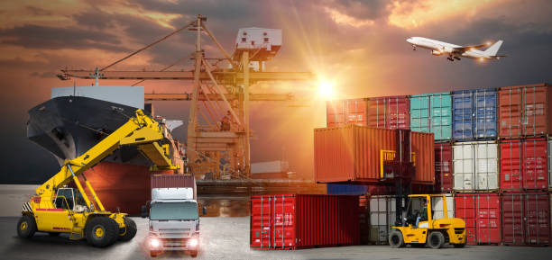 istock forklift handling container box loading to truck in import export logistic, Business logistics concept 888526046
