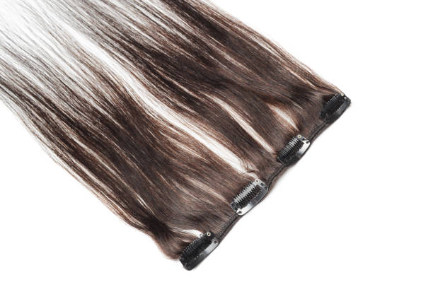 istock Clip in natural black straight human hair extensions 888540360