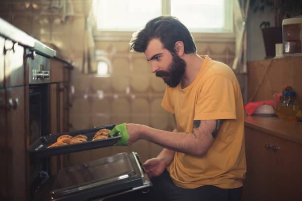 istock Bearded man baking pastries in the kitchen 888543318