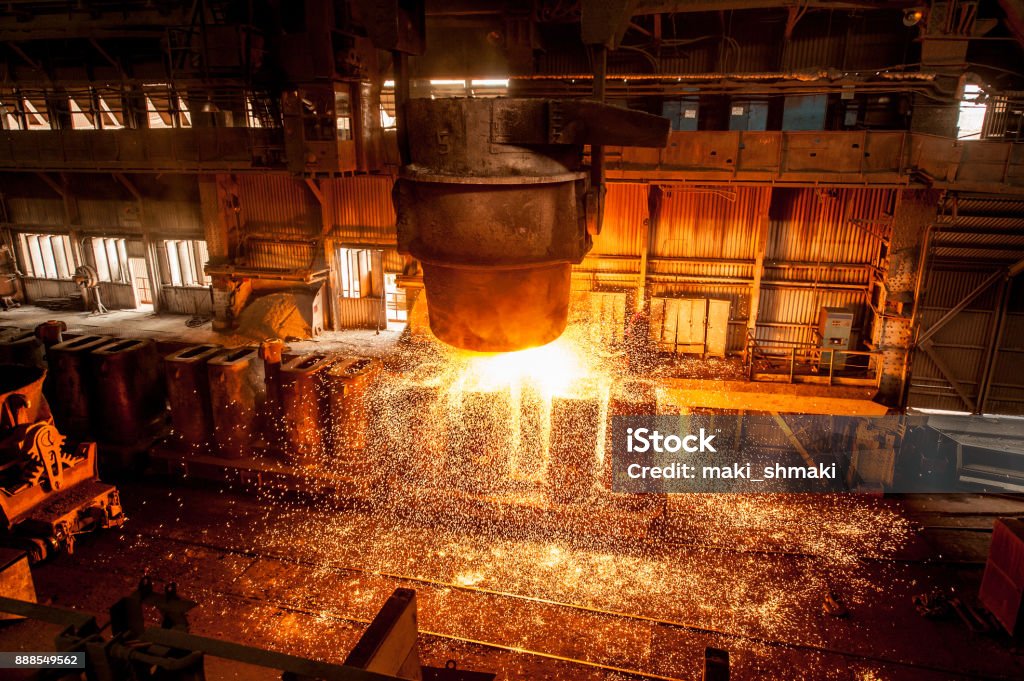 Tank pours the liquid steel in the forms Tank pours the liquid steel in the forms. Steel mill. Steel Mill Stock Photo