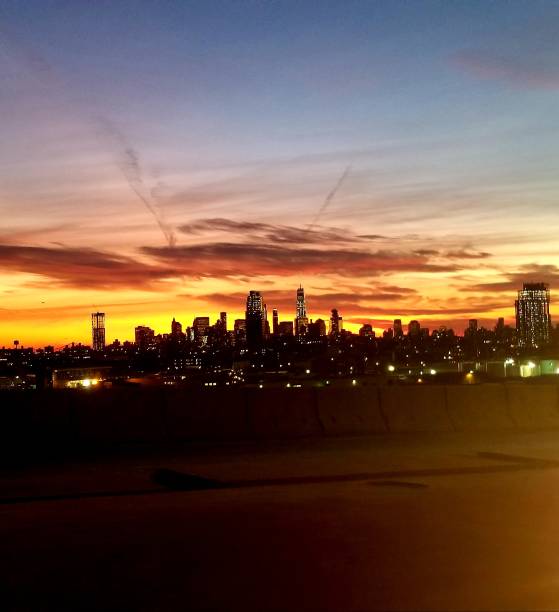 istock Sunset over New York sky line 888571520