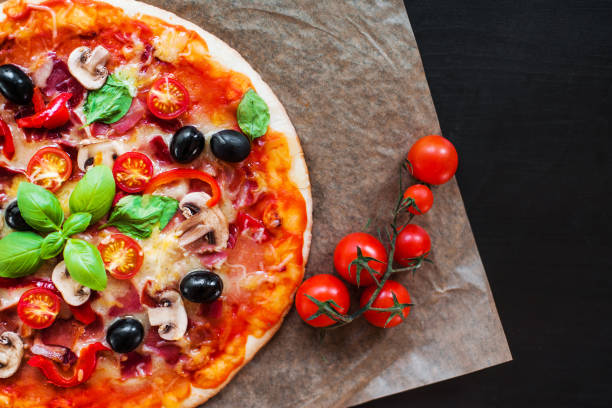 hot pizza slice with pepperoni, cheese, mozzarella and tomato  on a rustic background  close up. "n - pepperoni pizza green olive italian cuisine tomato sauce imagens e fotografias de stock