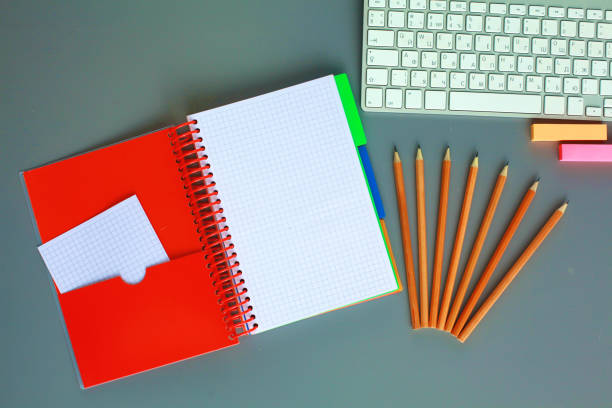 istock office desk with laptop, pen, and notebook. Top view 888575852