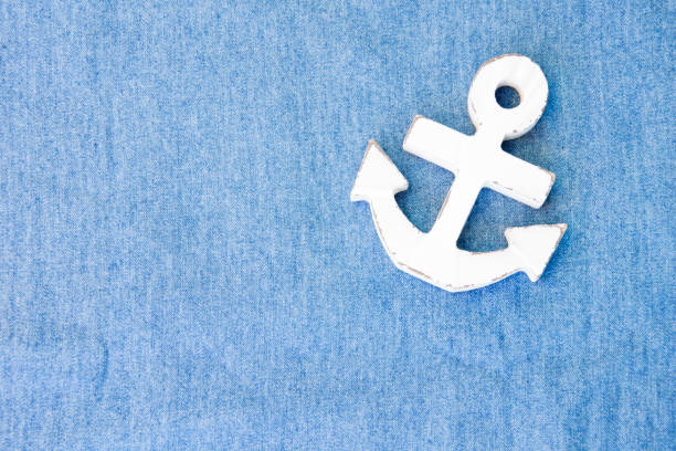 istock A white wood anchor on fabric for background 888590600