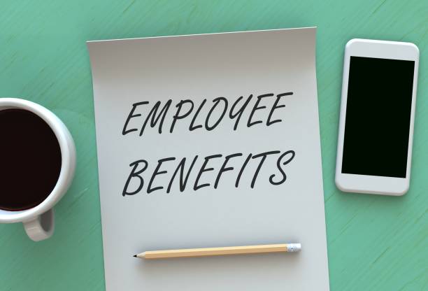 istock EMPLOYEE BENEFITS, message on paper, smart phone and coffee on table 888617348
