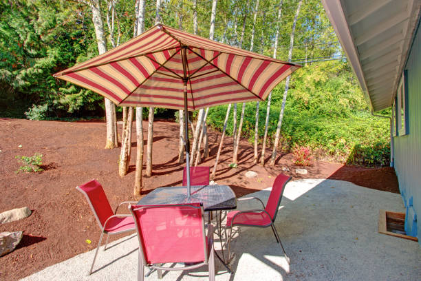 istock Backyard Patio With Red Striped Umbrella 888630036