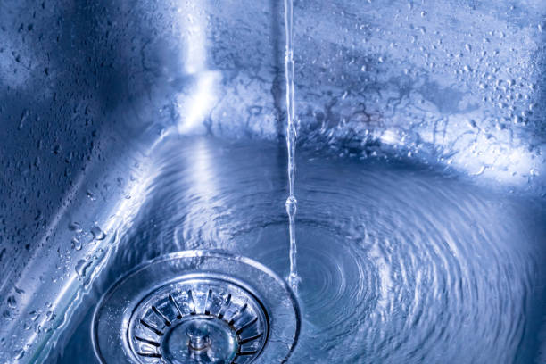 istock Drops of water falling on the surface of the kitchen sink. 888640542