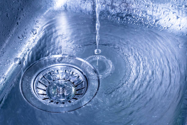 istock Drops of water falling on the surface of the kitchen sink. 888640614