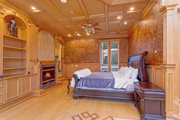 istock Welcoming mansion bedroom with a rustic wood coffered ceiling 888656970